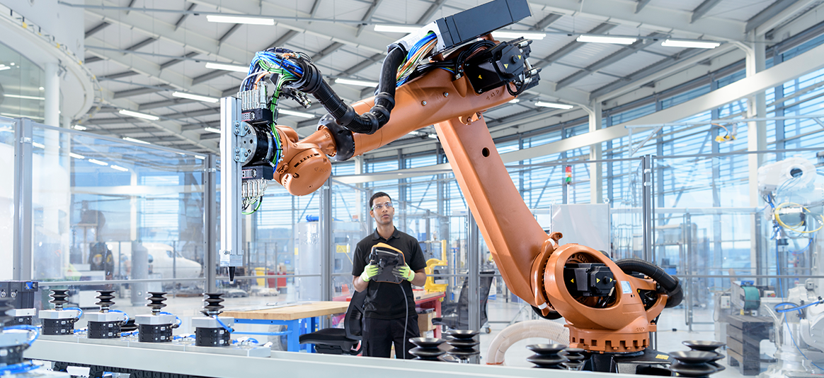 Person operating manufacturing robot