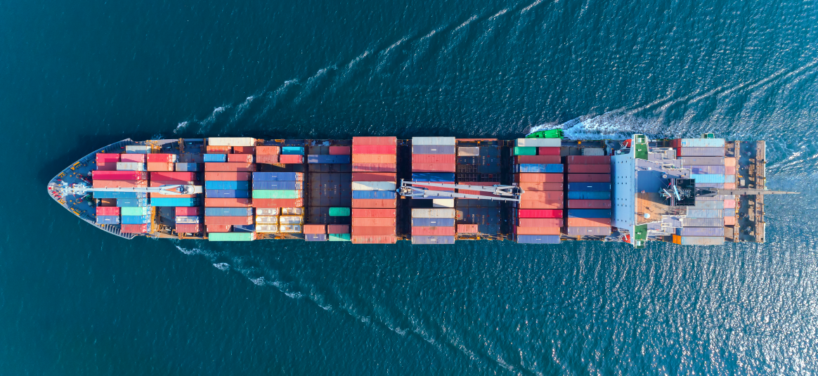 A container ship passes through the sea.